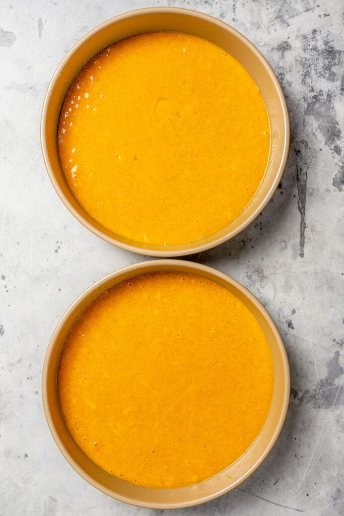 Divided cake batter in the cake pans.