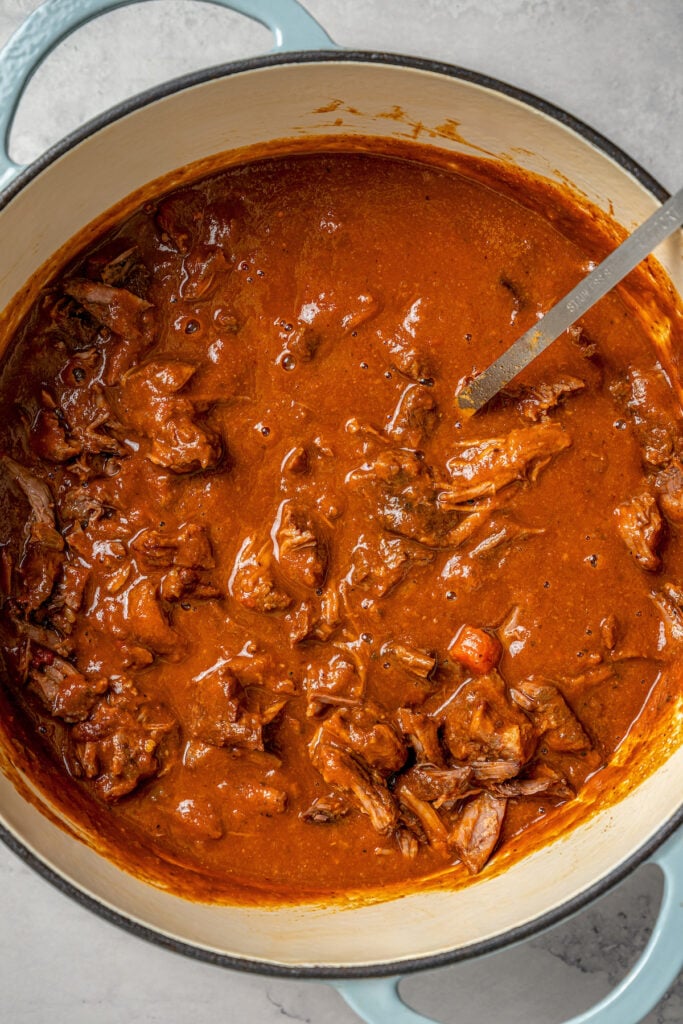 Short ribs in the Dutch oven with the blended sauce. 